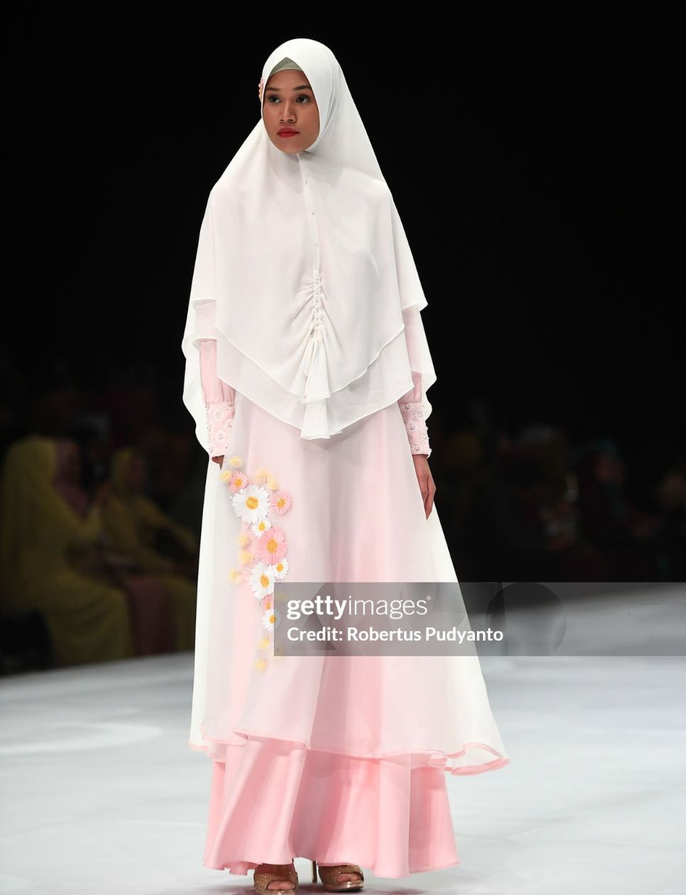 A model showcases designs on the runway during the Amily Hijab show as part of Indonesia Fashion Week 2019 on March 28, 2019 in Jakarta, Indonesia. (Photo by Robertus Pudyanto/Getty Images)