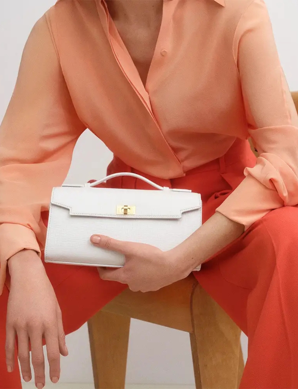 1. Anya Hindmarch Mortimer Clutch Bag White