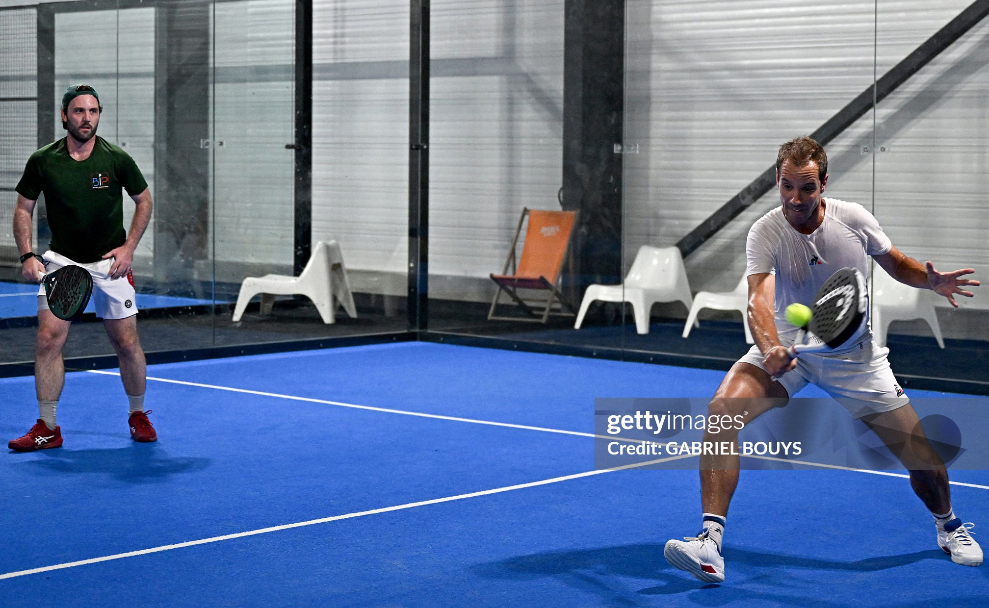 French former tennis player Richard Gasquet (R) and teammate Guillaume Lautier play on a padel tennis court at the Beziers Indoor Padel club in Beziers, southern France on July 22, 2025. The padel, a mixture of tennis and squash, is played in teams of two on a court that is typically surrounded by glass walls which players can bounce balls off. (Photo by GABRIEL BOUYS / AFP) (Photo by GABRIEL BOUYS/AFP via Getty Images)