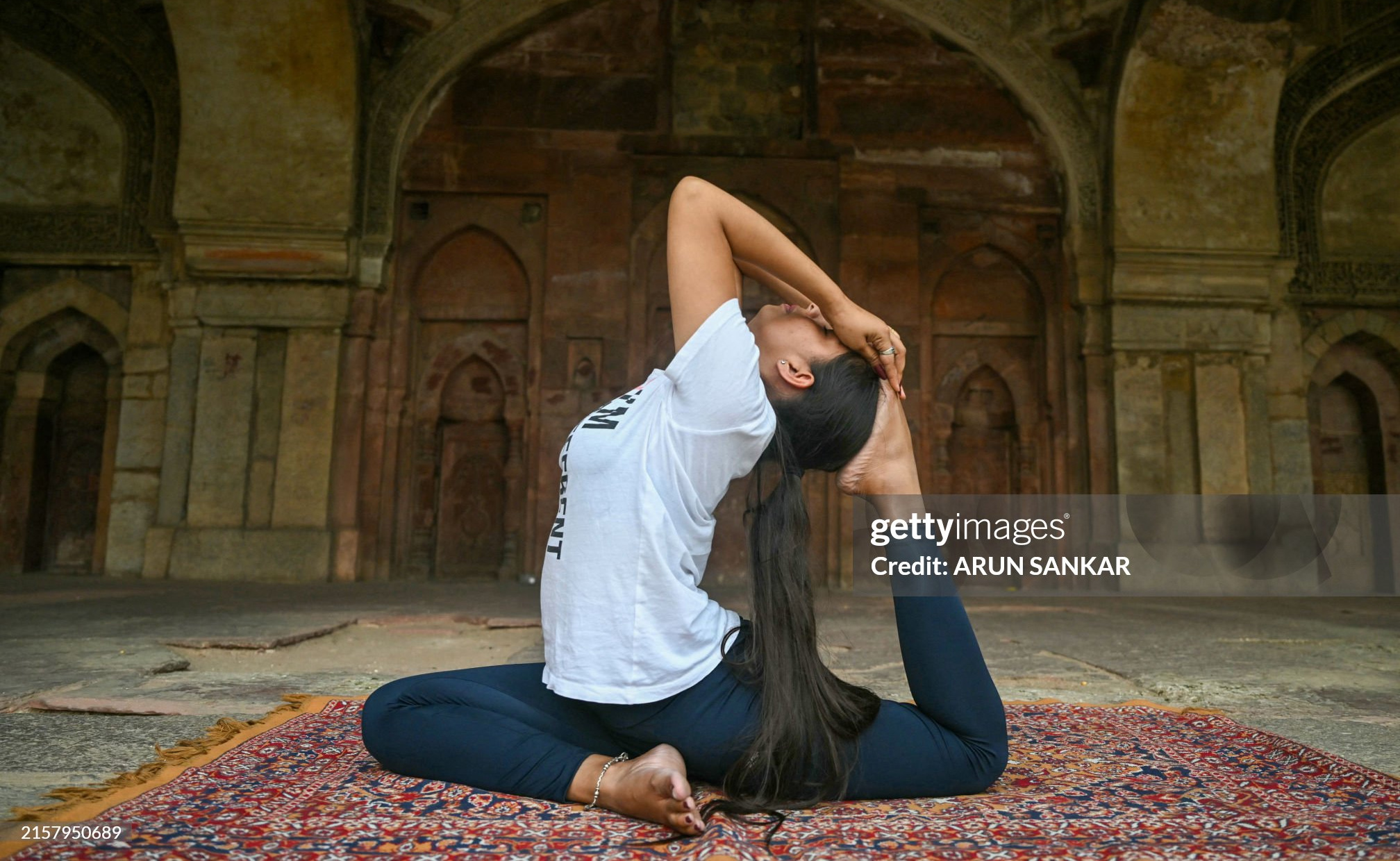 A woman performs yoga at Lodhi gardens on International Day of Yoga, in New Delhi on June 21, 2024. (Photo by ARUN SANKAR / AFP) (Photo by ARUN SANKAR/AFP via Getty Images)