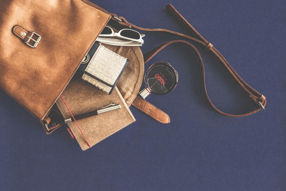 Brown Leather Crossbody Bag With White Framed Sunglasses (pexels.com)