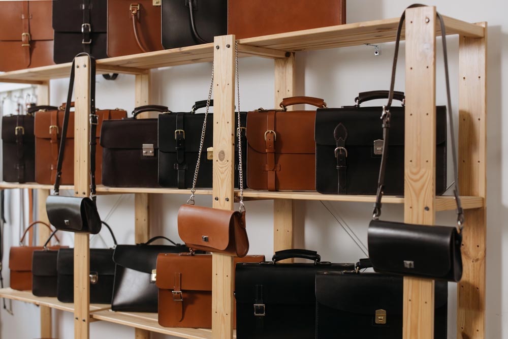 Leather Bags on Wooden Shelves (pexels.com)