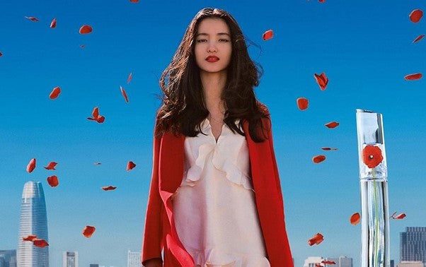 A picture containing sky, kite, person, colorful Description automatically generated